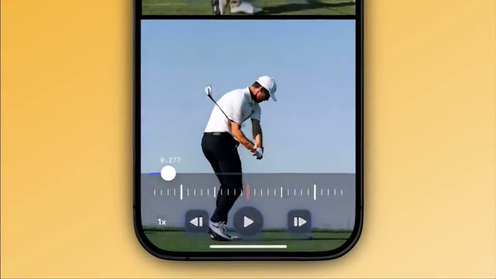 Slow-motion golf swing frame from a WithCoach coaching video